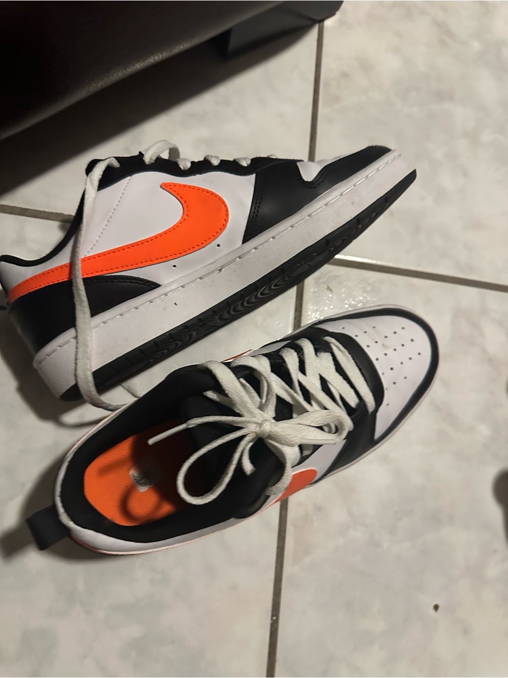 Nike Kids Low-Top Sneakers in Black, White & Orange Swoosh
